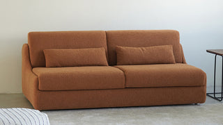 The Architecture of Reclining Elegance: Welcoming Mid-Century Bouclé Textures and Multi-Functional Fluidity into Modern Living Spaces