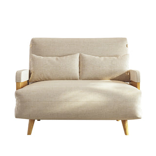 A beige linen convertible loveseat features wooden armrests and tapered legs against a clean white background. Two matching rectangular lumbar pillows rest neatly against its supportive backrest. This versatile piece combines a cozy modern aesthetic with functional design.