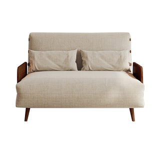 A beige linen convertible loveseat features dark wood armrests and tapered legs against a clean white background. Two matching rectangular lumbar pillows rest neatly against its supportive backrest. This versatile piece combines a cozy modern aesthetic with functional design.