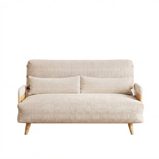 A beige linen convertible loveseat features wooden armrests and tapered legs against a clean white background. Two matching long bolster pillows rest neatly against its supportive backrest. This versatile piece combines a cozy modern aesthetic with functional design.