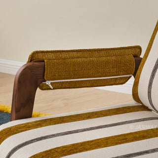 A close-up shot highlights the plush yellow armrest cover wrapped over the dark wooden arm of a striped convertible armchair. The textured fabric cushion is secured with a visible white zipper along its lower edge. The striped upholstery of the chair seat is partially visible in the foreground against a light-colored floor.