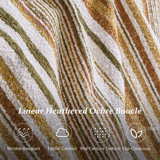 A close-up product image showcases the linear heathered ochre bouclé fabric texture with diagonal stripes in white, olive green, and warm ochre tones. Text overlay reads "Linear Heathered Ochre Bouclé," accompanied by four feature icons and labels highlighting its wrinkle-resistant nature, tactile comfort, mid-century texture, and eco-conscious design.
