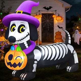 Giant Halloween inflatable skeleton dachshund yard decoration featuring spooky bone prints, a purple witch hat, and a glowing jack-o-lantern pumpkin candy bucket for outdoor lawn displays.