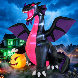 Outdoor Halloween inflatable decoration featuring a large black and purple dragon with glowing red eyes, sharp claws, and a jack-o'-lantern pumpkin in a spooky nighttime yard display.