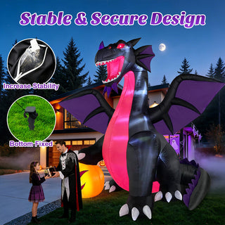 Stable and secure design detail view of a large Halloween inflatable decoration showcasing water-weight stability bags, ground stakes, and a black and purple dragon in a festive yard display.