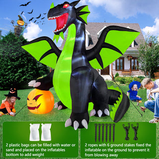 Stability and installation guide graphic for a large Halloween inflatable black and neon green dragon yard decoration, highlighting included water weight bags, tether ropes, and ground stakes to prevent blowing away in the yard.