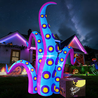 Packaging box setup showcase for a giant Halloween inflatable blue and purple monster tentacle yard decoration, displayed on a front lawn with festive lighting and a starry night sky in the background.