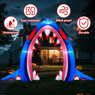 Durable, waterproof, wind-proof, and tear-resistant fabric feature guide graphic for a giant inflatable shark mouth archway yard decoration, displayed on a glowing residential lawn at night for Halloween.