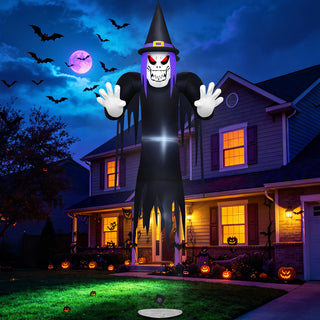 Giant Halloween inflatable spooky reaper and floating grim ghost yard decoration featuring a black tattered witch hat, skull face with glowing red eyes, purple hair, and outstretched hands, displayed on a haunted house lawn under a glowing pink full moon and flying bats.