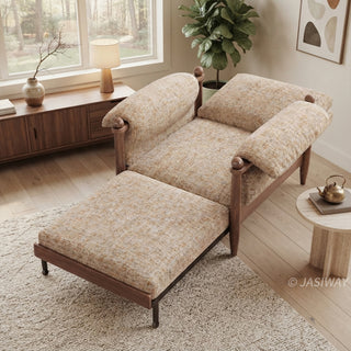 High-angle lifestyle staging shot of a convertible accent armchair with its pull-out footrest extended, featuring beige textured fabric and dark wood framing in a sunlit living room.
