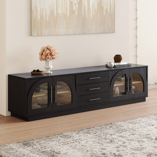 JASIWAY 78-inch mid-century modern TV stand in a black wood finish, featuring four arched tempered glass doors with interior shelving and three central storage drawers, and a low-profile silhouette for contemporary living room entertainment centers.-Three-quarter view
