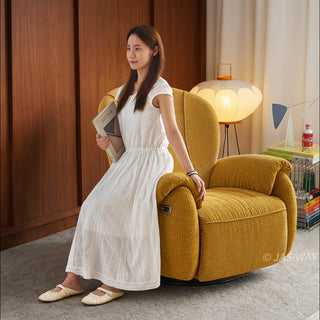 JASIWAY textured chenille fabric power swivel recliner chair featuring 270-degree rotation and an electric reclining mechanism with a smooth adjustable backrest and integrated extending footrest, designed with ergonomic cushioned armrests and built-in side controls.-Three quarter view with model sitting  the armrest