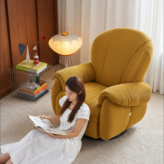 JASIWAY textured chenille fabric power swivel recliner chair featuring 270-degree rotation and an electric reclining mechanism with a smooth adjustable backrest and integrated extending footrest, designed with ergonomic cushioned armrests and built-in side controls.-High-angle view with model sitting on the floor