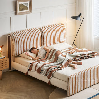 JASIWAY modern luxury upholstered platform bed frame featuring a curved wingback shelter headboard and premium textured chenille fabric upholstery in a neutral, multi-toned weave, available in queen and king sizes for high-end contemporary bedroom interiors.-High-angle view with model sleeping