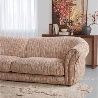 JASIWAY luxury curved chenille sofa featuring a structural biomorphic design, deep seat cushions, and premium textured multi-tonal chenille upholstery. This modern cloud couch showcases tailored rolled arms with integrated piping details and an organic, gently arched back silhouette.-Medium shot