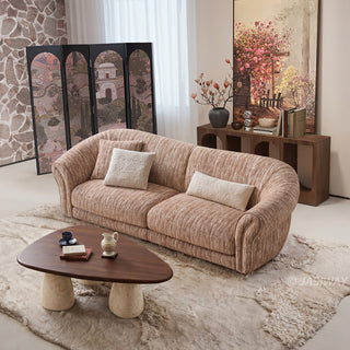 JASIWAY luxury curved chenille sofa featuring a structural biomorphic design, deep seat cushions, and premium textured multi-tonal chenille upholstery. This modern cloud couch showcases tailored rolled arms with integrated piping details and an organic, gently arched back silhouette.-High-angle view