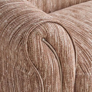 JASIWAY luxury curved chenille sofa featuring a structural biomorphic design, deep seat cushions, and premium textured multi-tonal chenille upholstery. This modern cloud couch showcases tailored rolled arms with integrated piping details and an organic, gently arched back silhouette.-Close-up of armrest