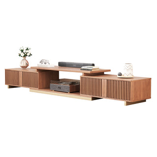 JASIWAY extendable media console featuring vertical fluted wood design two spacious side cabinets and a gold-finish recessed plinth base, shown in a low-profile architectural design with a telescopic adjustable top to accommodate TVs up to 85 inches.-Three-quarter studio shot