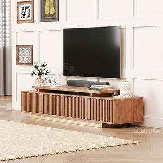 JASIWAY extendable media console featuring vertical fluted wood design two spacious side cabinets and a gold-finish recessed plinth base, shown in a low-profile architectural design with a telescopic adjustable top to accommodate TVs up to 85 inches.-Three-quarter view