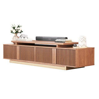 JASIWAY extendable media console featuring vertical fluted wood design two spacious side cabinets and a gold-finish recessed plinth base, shown in a low-profile architectural design with a telescopic adjustable top to accommodate TVs up to 85 inches.-Three-quarter studio shot