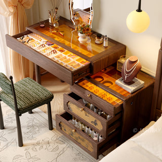 JASIWAY solid wood extendable vanity desk featuring a rich walnut-grain finish, a three-drawer side storage cabinet ,and a decorative tempered glass top, specifically engineered for luxury small-space interiors.-High-angle view with drawers open