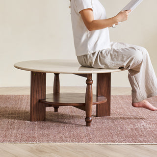 JASIWAY mid-century modern round coffee table featuring a polished beige faux marble top and a 2-tier functional design with a walnut-finished solid wood storage shelf and base.-Durability and load-bearing test