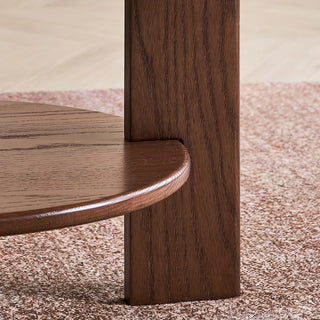 JASIWAY mid-century modern round coffee table featuring a polished beige faux marble top and a 2-tier functional design with a walnut-finished solid wood storage shelf and base.-Leg joinery detail