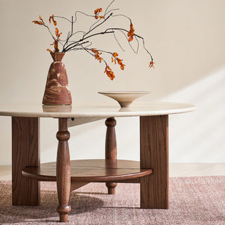 JASIWAY mid-century modern round coffee table featuring a polished beige faux marble top and a 2-tier functional design with a walnut-finished solid wood storage shelf and base.-Low-angle front view
