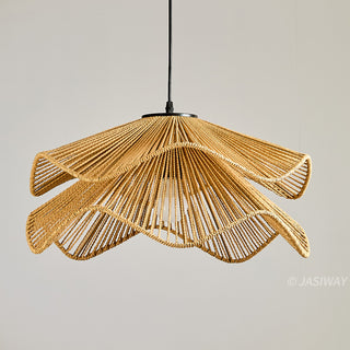 This pendant light features a sculptural, double-layered shade hand-crafted from natural fiber rope in a warm, earthy tone. Its flowing, wave-like silhouette creates a sophisticated botanical aesthetic that pairs perfectly with modern, organic interiors. The intricate rope detailing adds textural depth, casting soft and inviting illumination throughout the space.