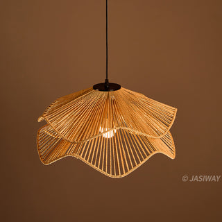 This pendant light features a sculptural, double-layered shade hand-crafted from natural fiber rope in a warm, earthy tone. Its flowing, wave-like silhouette creates a sophisticated organic aesthetic that adds textural depth to any space. The intricate rope detailing casts soft, inviting illumination, perfect for a curated, modern interior.