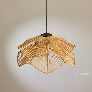 This pendant light features a sculptural, double-layered shade hand-crafted from natural fiber rope in a warm, earthy tone. Its flowing, wave-like silhouette creates a sophisticated organic aesthetic that adds textural depth to any space. The intricate rope detailing casts soft, inviting illumination, perfect for a curated, modern interior.