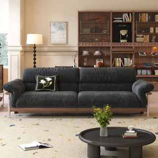 JASIWAY mid-century modern 3-seater sofa featuring textured chenille upholstery, sculptural curved armrests with integrated solid wood supports, and a low-profile exposed timber base frame accented by slender polished metal legs.-Front view