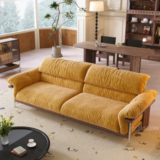JASIWAY mid-century modern 3-seater sofa featuring textured chenille upholstery, sculptural curved armrests with integrated solid wood supports, and a low-profile exposed timber base frame accented by slender polished metal legs.-High-angle view