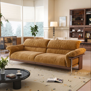 JASIWAY mid-century modern 3-seater sofa featuring textured chenille upholstery, sculptural curved armrests with integrated solid wood supports, and a low-profile exposed timber base frame accented by slender polished metal legs.-Three-quarter view