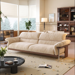 JASIWAY mid-century modern 3-seater sofa featuring textured chenille upholstery, sculptural curved armrests with integrated solid wood supports, and a low-profile exposed timber base frame accented by slender polished metal legs.-Three-quarter view