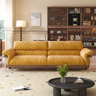 JASIWAY mid-century modern 3-seater sofa featuring textured chenille upholstery, sculptural curved armrests with integrated solid wood supports, and a low-profile exposed timber base frame accented by slender polished metal legs.-Front view