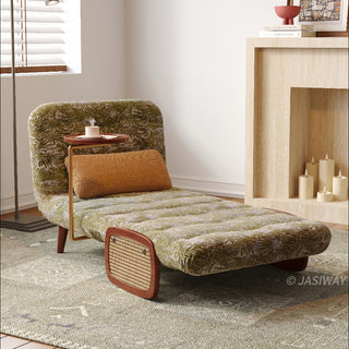 JASIWAY mid-century modern convertible sleeper chair bed upholstered in premium botanical jacquard fabric with olive green palm leaf patterns. Features a space-saving multi-functional design with an integrated swivel wooden side table, woven rattan armrest details, solid wood tapered legs, and a textured mustard lumbar support pillow. Ideal luxury accent sleeper lounger for high-end apartment living and compact spaces.-Three quarter view with chaise mode