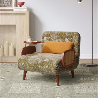 JASIWAY mid-century modern convertible sleeper chair bed upholstered in premium botanical jacquard fabric with olive green palm leaf patterns. Features a space-saving multi-functional design with an integrated swivel wooden side table, woven rattan armrest details, solid wood tapered legs, and a textured mustard lumbar support pillow. Ideal luxury accent sleeper lounger for high-end apartment living and compact spaces.-Three quarter view