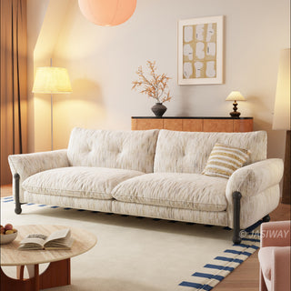 JASIWAY mid-century modern deep seat sofa featuring premium textured chenille upholstery, plush tufted back cushions, and architectural solid wood legs. This contemporary 3-seater couch combines minimalist aesthetic with a deep-set lounge profile for luxury living room seating.-Three quarter view