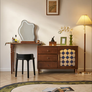 Mid-century modern solid wood makeup vanity table featuring an extendable desktop and integrated storage chest with decorative glass door, complemented by tapered legs and a space-saving telescopic configuration suitable for versatile bedroom storage.-Front view