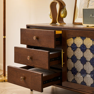 Mid-century modern solid wood makeup vanity table featuring an extendable desktop and integrated storage chest with decorative glass door, complemented by tapered legs and a space-saving telescopic configuration suitable for versatile bedroom storage.-Close-up of drawers open