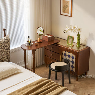 Mid-century modern solid wood makeup vanity table featuring an extendable desktop and integrated storage chest with decorative glass door, complemented by tapered legs and a space-saving telescopic configuration suitable for versatile bedroom storage.-High-angle view of L-shape