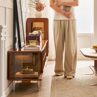 JASIWAY mid-century modern TV stand featuring a rich walnut and boxwood finish, sliding cabinet doors with olive green grid accents, and open tempered glass shelving, blending organic retro aesthetics with functional storage for upscale living room entertainment centers.-Side view