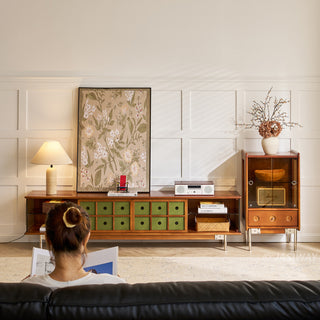 JASIWAY mid-century modern TV stand featuring a rich walnut and boxwood finish, sliding cabinet doors with olive green grid accents, and open tempered glass shelving, blending organic retro aesthetics with functional storage for upscale living room entertainment centers.-Front view