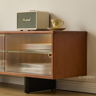 JASIWAY mid-century modern low-profile media console featuring walnut wood and boxwood finish, fluted glass sliding doors, and sleek black support legs with integrated open shelving and modular storage.-Medium close-up