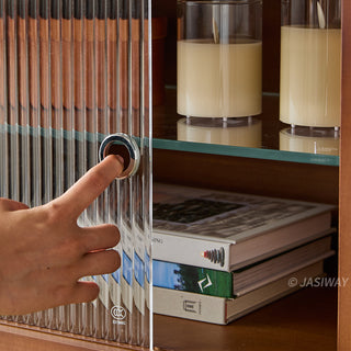 JASIWAY mid-century modern low-profile media console featuring walnut wood and boxwood finish, fluted glass sliding doors, and sleek black support legs with integrated open shelving and modular storage.-Close-up od sliding door