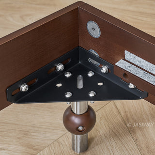 A close-up, high-angle view highlighting the robust structural engineering of the bed corner, featuring a heavy-duty black metal corner bracket securely fastened to the solid wood frame, supported by a distinctive spherical wooden leg with a polished metal insert.