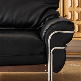 JASIWAY modern black top-grain leather sofa with adjustable headrests, luxury 3-seater couch featuring premium genuine leather upholstery, ergonomic cushioning, and sturdy wooden frame for a high-end living room aesthetic.-Close-up of armrest and support leg