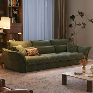 JASIWAY modern 3-seater fabric sofa with adjustable high-back headrests and deep-seated cloud cushions, featuring a low-profile minimalist design and ergonomic neck support with a high-end, contemporary aesthetic for luxury living rooms. -Three-quarter view of warm lighting
