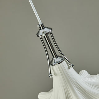A detailed, close-up shot focuses on the polished chrome hardware that connects the white, fluted ceramic shade to the ceiling cord. The sleek, modern metal structure contrasts beautifully with the soft, organic texture of the flower-shaped ceramic piece below.